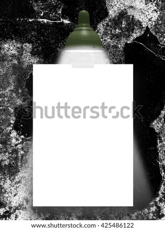 Close-up of one blank frame hanged by clip against black and white abstract art background