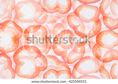 Abstract background of rings paprika. Vegetable background. Food background. Delicate pastel summer background.