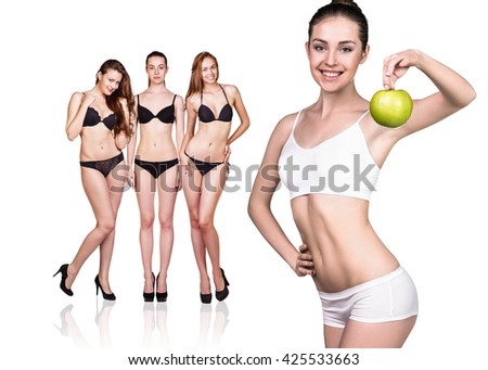 Beautiful woman holds green apple.