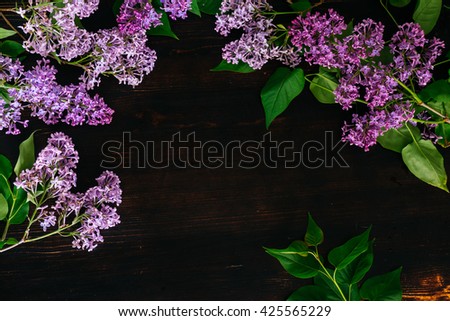 Top view at the table with lilac flowers