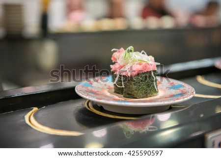 Japanese food parcel sushi on rotational belt
