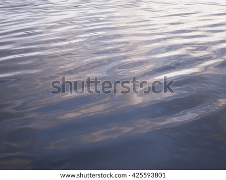 Calm water at sunset
