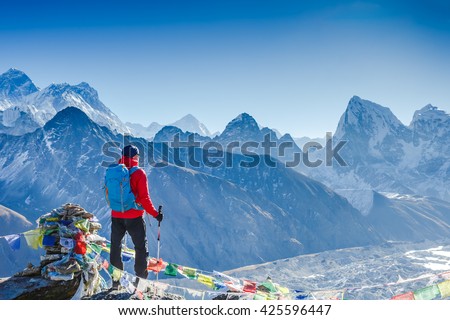 Hiker trekking in the mountains. Sport and active life Royalty-Free Stock Photo #425596447