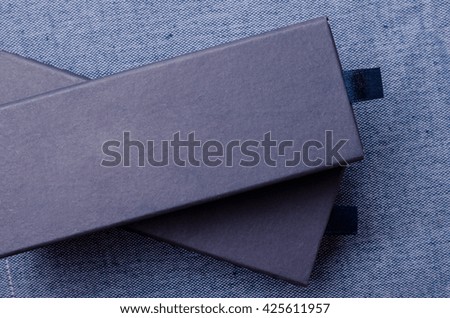 Close up of blue boxes on blue fabric background