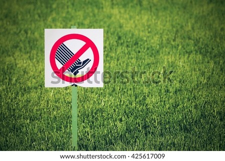 the symbol or sign of a ban is established in park and means the warning information that on lawns not to go