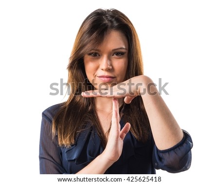 Young girl making time out gesture