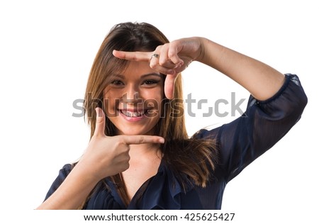 Young girl focusing with her fingers