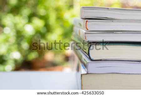 Books with bokeh nature background Royalty-Free Stock Photo #425633050