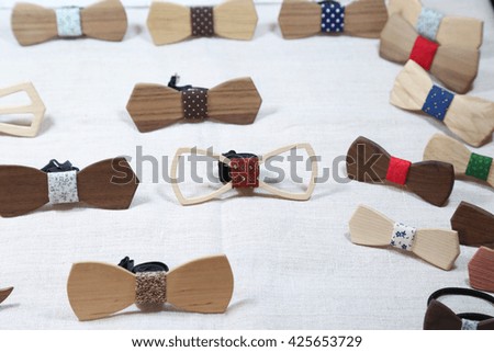 Collection set of various wooden bow ties on light background