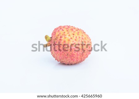 Single lychee on white background