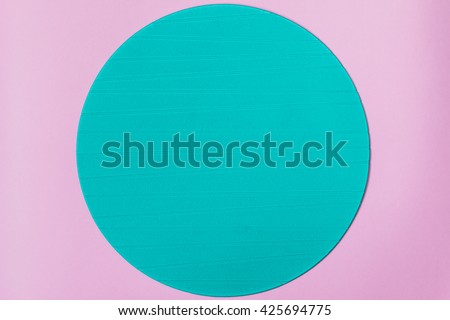 Blue round stand on pink background. Minimal concept. Flat lay, top view.
