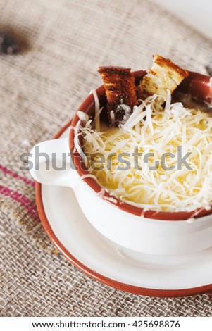 French onion gratin soup with croutons selective focus