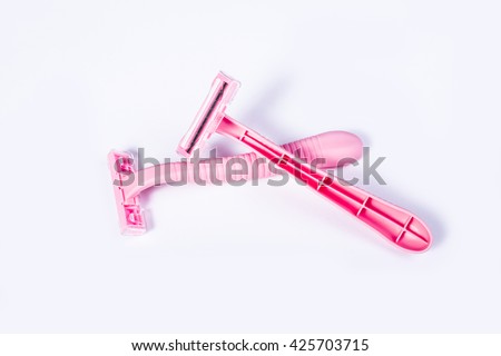 Pink female razors isolated on the white background Royalty-Free Stock Photo #425703715