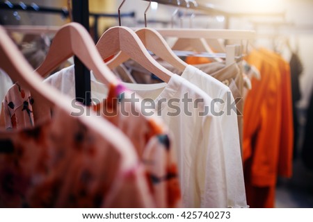 Clothing on hanger at the modern shop boutique Royalty-Free Stock Photo #425740273