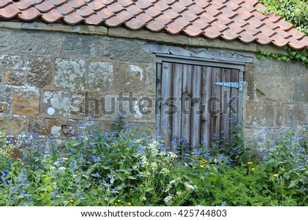 Old Stone Building Overgrown With Flowers, Yorkshire.