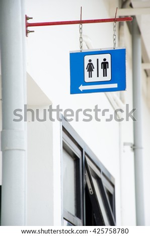 restroom signs with  symbol and arrow direction signs
