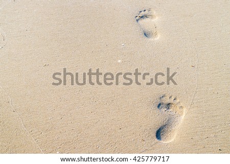 footprints on the beach for nature background