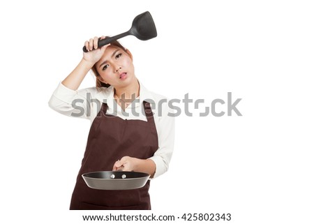 Exhausted Asian girl cook with frying pan  isolated on white background