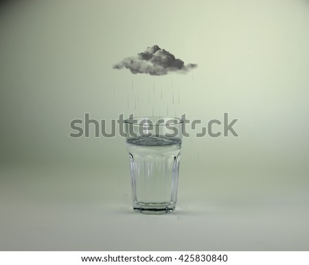 Raincloud over glass of water photo manipulation/Raining into glass of water Royalty-Free Stock Photo #425830840