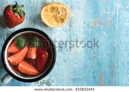 Homemade and fresh strawberry juice in the cup,empty space and selective focus 