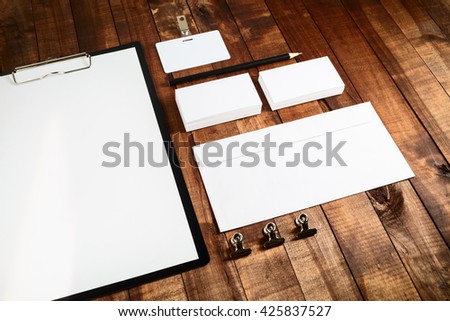 Photo of blank stationery set. Blank corporate identity template for branding identity for designers. Mockup for ID. Letterhead, business cards, badge, envelope and pencil.