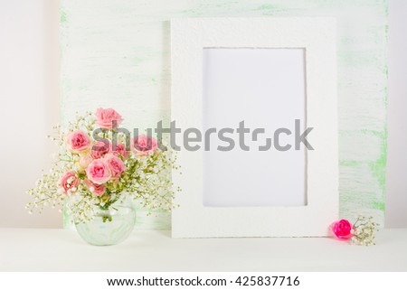 White frame mockup with roses in vase. Frame mockup. White frame mockup. 