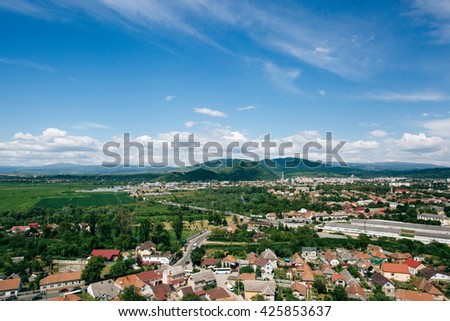 View of the small city from the fortress in mountains Royalty-Free Stock Photo #425853637