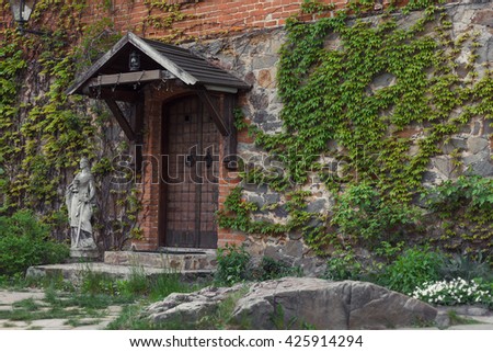 Beautiful wooden door leading inside the castle