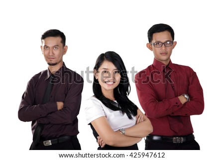 Three attractive Asian professional business workers standing with arms crossed pose, isolated on white background