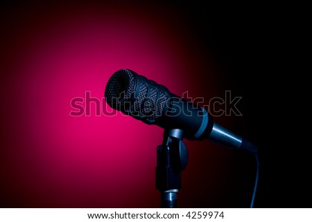 A Microphone In A Red Spotlight