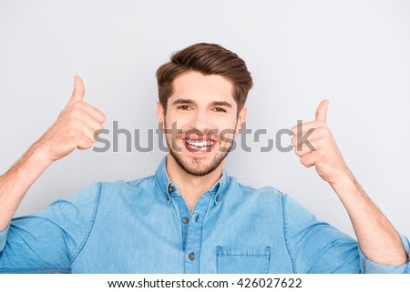 Cheerful happy man gesturing "LIKE" with two hands