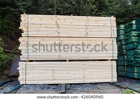 a lot of sawmill raw wooden boards, in a pile, drying process
