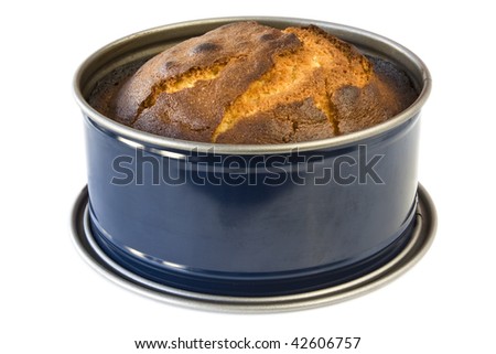 Cake in a baking pan isolated on white background