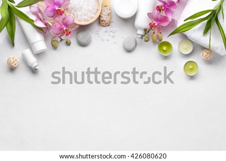 Towel,orchid flowers,bamboo leaf and cosmetics Royalty-Free Stock Photo #426080620