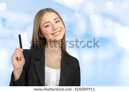 Young business woman with credit card