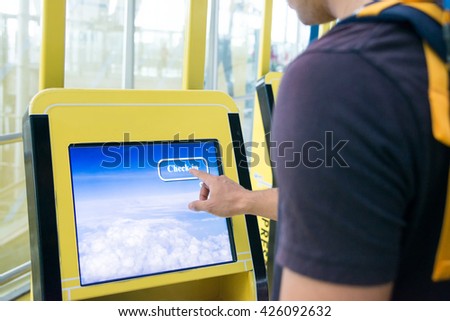 Using self check-in  kiosks in airport Royalty-Free Stock Photo #426092632