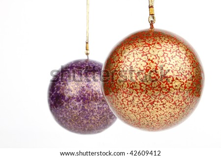 Two decorative balls  hanging on white background