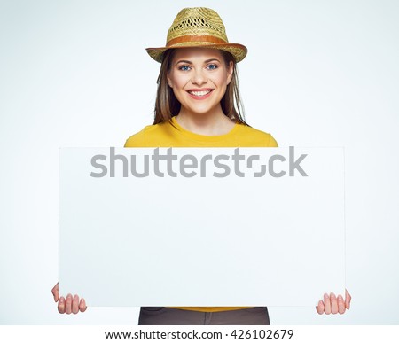 Hipster style girl holding big white sign board. Advertising banner. Yellow hat.