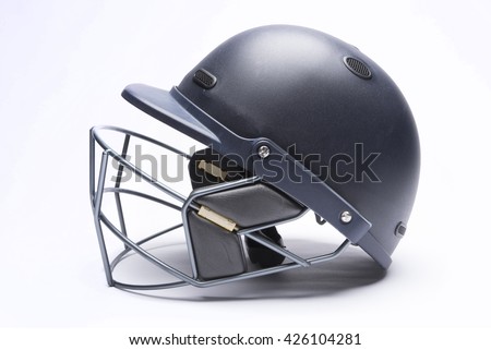 Modern day cricket batting helmet with protective grill on white background