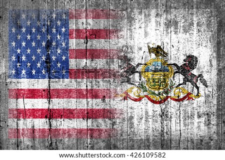 USA and Pennsylvania flag on concrete wall 