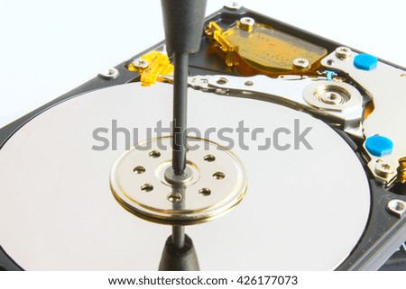 hdd 2,5 repair screwdriver and screws on a white background