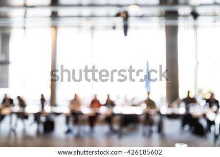 Abstract blur Business meeting, Conference and Presentation.  Seminar event room with window bokeh light background. Business concept