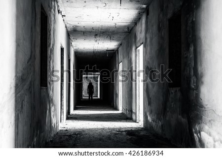 walkway in Abandoned building with scary woman inside, darkness horror and halloween background concept