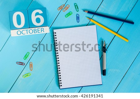 October 6th. Image of October 6 wooden color calendar on blue background. Autumn day. Empty space for text