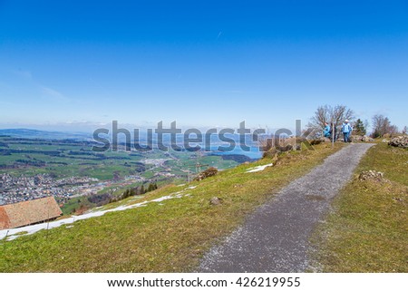Amazing trail view on the hill with an amazing aerial view over Switzerland.
