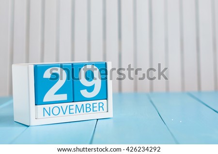November 29th. Image of november 29 wooden color calendar on blue background. Autumn day. Empty space for text