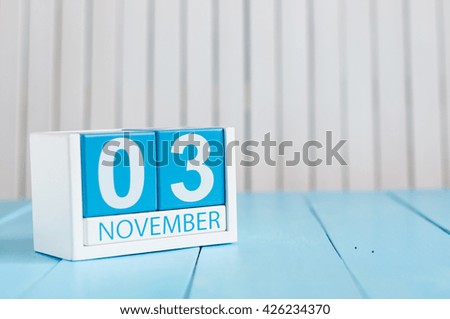 November 3rd. Image of november 3 wooden color calendar on blue background. Autumn day. Empty space for text