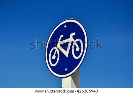 Bicycle sign with sky background on street