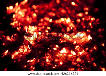 bright red hot charcoal fire screensaver close up