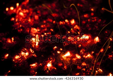 bright red hot charcoal fire screensaver close up